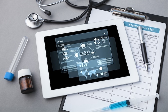 digital tablet with stethoscope wooden table 1